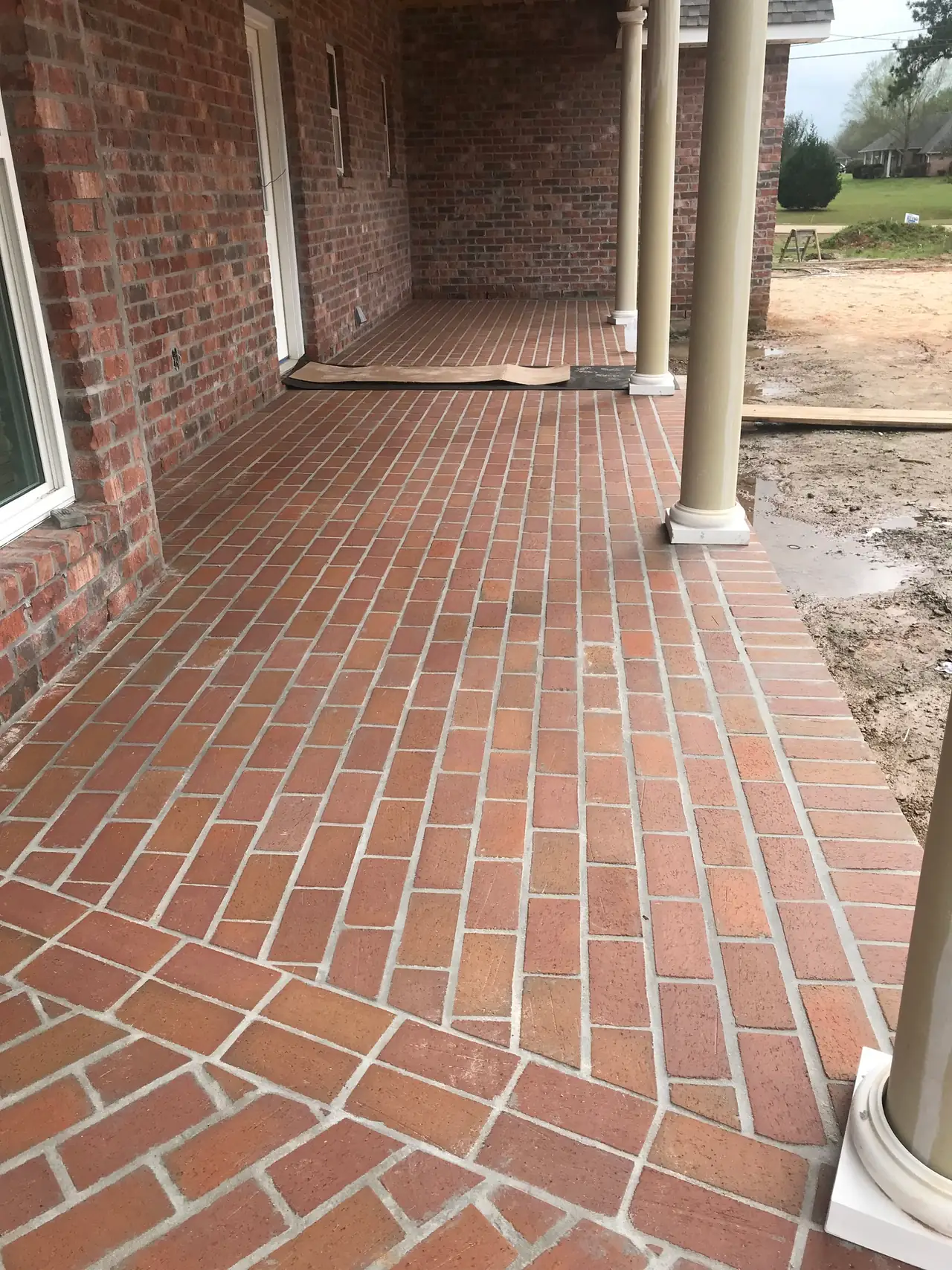 New brick paver porch floor with a soldier-course border